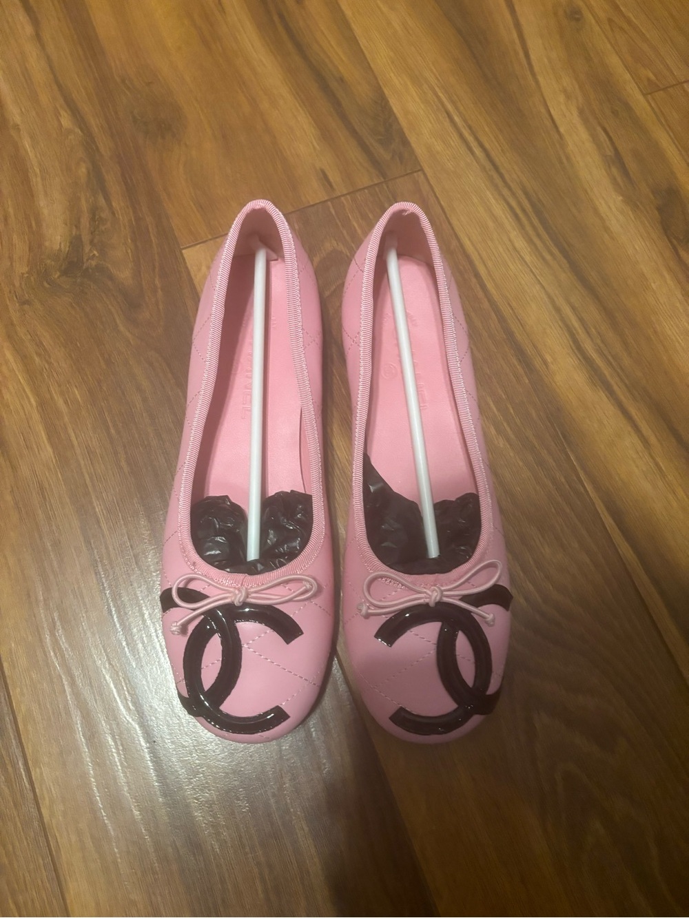 CHANEL Pink Ballet Flats with Black CC Emblem